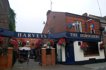 The Four Horseshoes Public House and yard July 2008